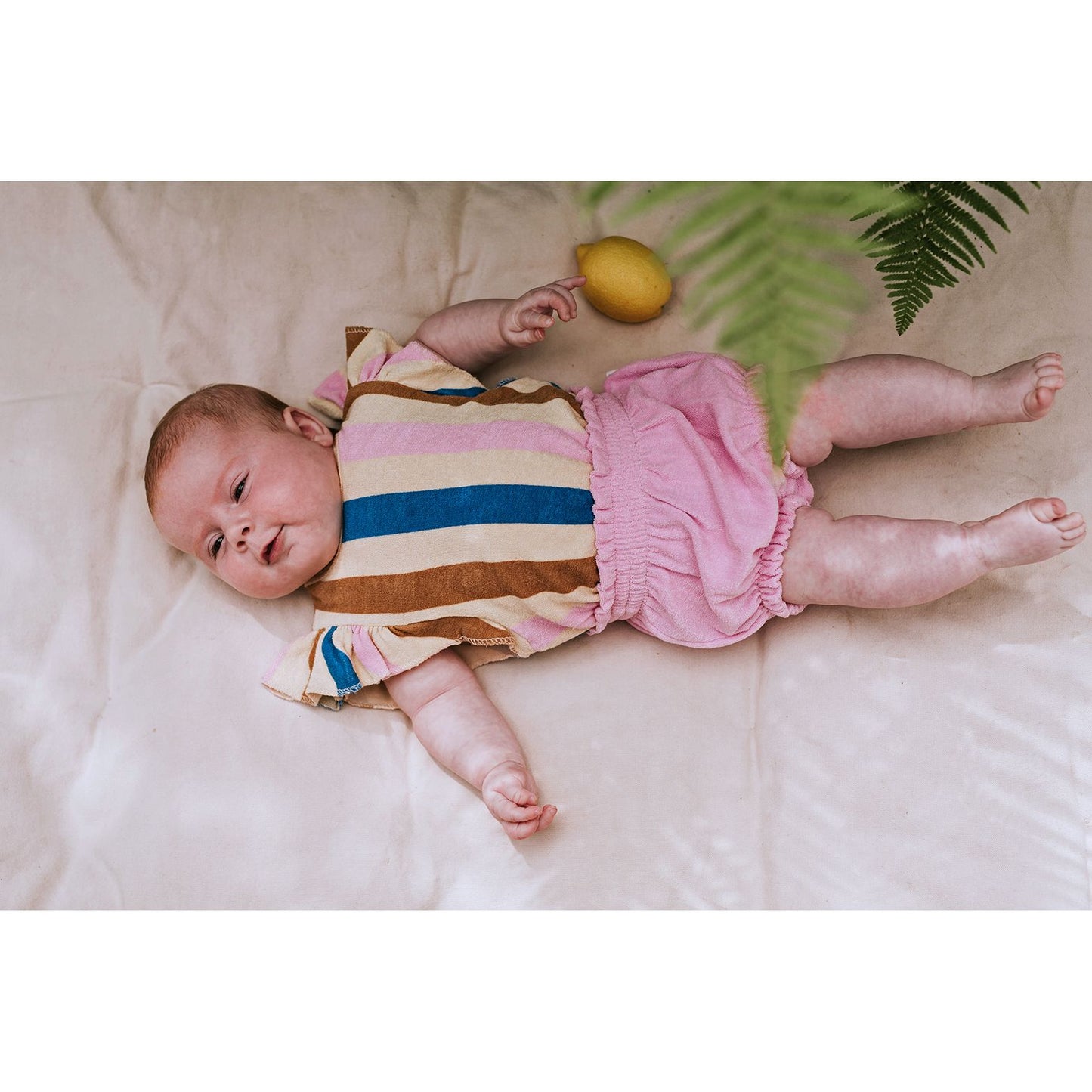 Baby romper with ruffles and multicolored stripes | Sproet & Sprout