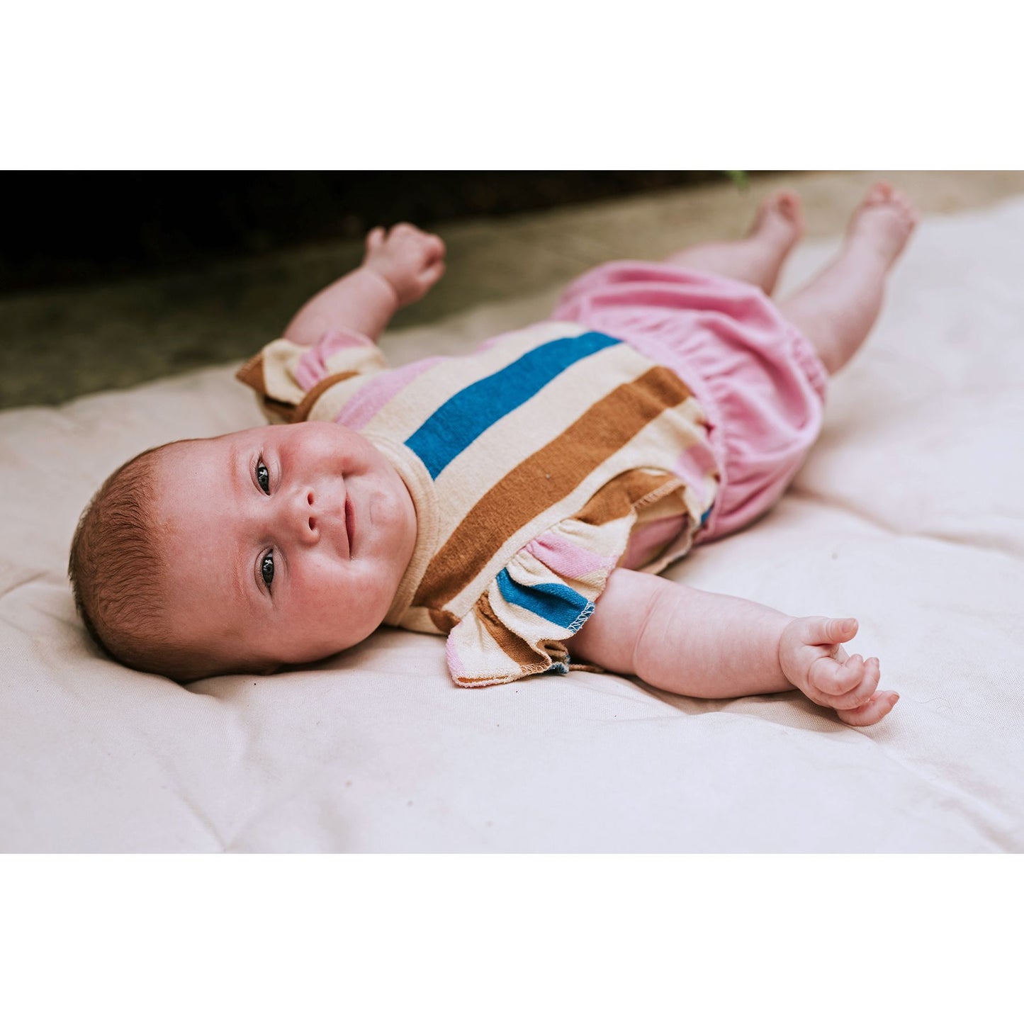 Baby romper with ruffles and multicolored stripes | Sproet & Sprout